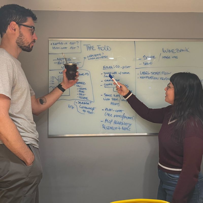 Jams team at the whiteboard during a shaping session